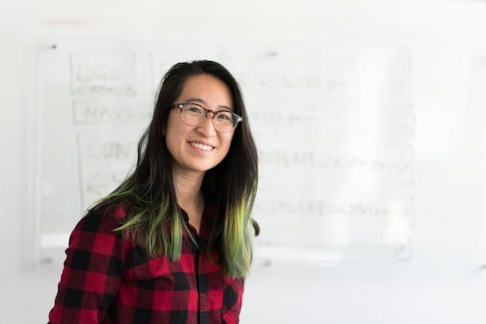 Smiling woman in a checked shirt